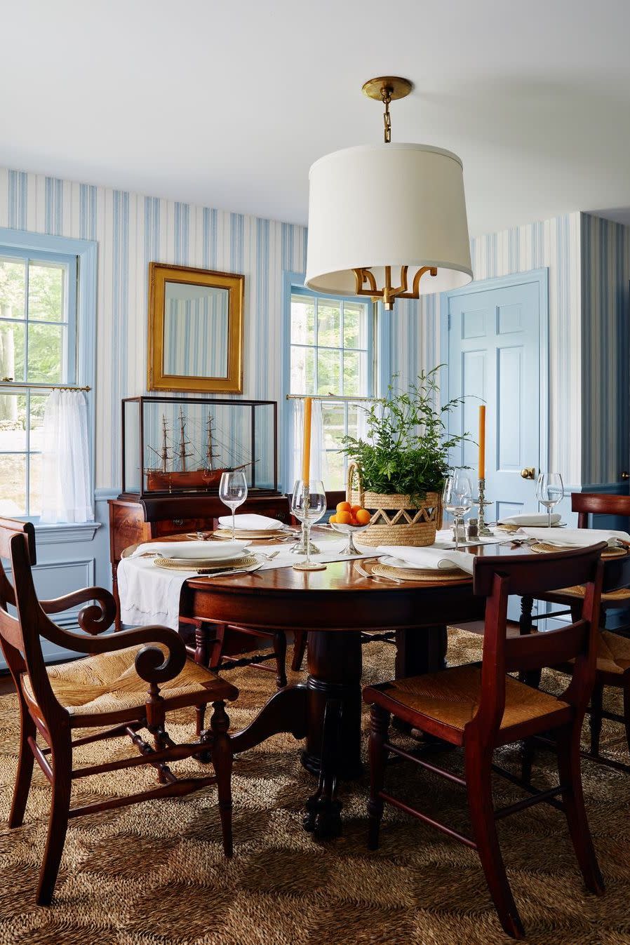 a dining room table with a lamp