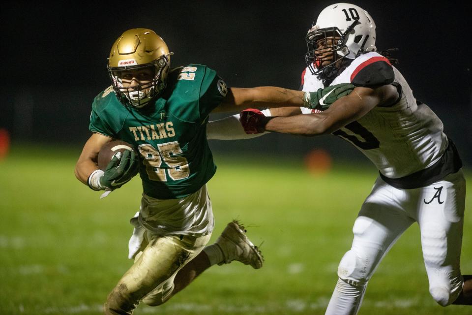 Boylan's Austin Alonso breaks a tackle and runs in for a touchdown against Auburn on Friday, Sept. 22, 2023, at Boylan High School in Rockford.