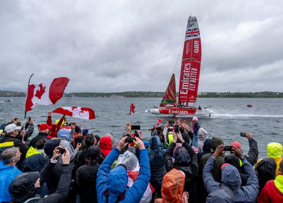 In this photo provided by SailGP, Emirates Great Britain SailGP Team, helmed by Giles Scott, heads toward the finish line to win the Canada Sail Grand Prix on Race Day 2 in Halifax, Canada, Sunday, June 2, 2024.