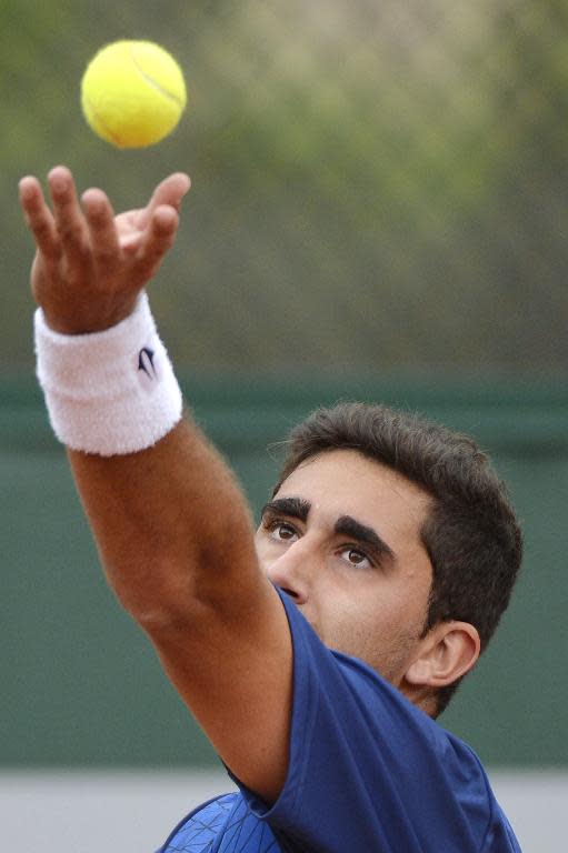 File photo of Argentina's Facundo Arguello, serving during a match in Paris, on May 25, 2014