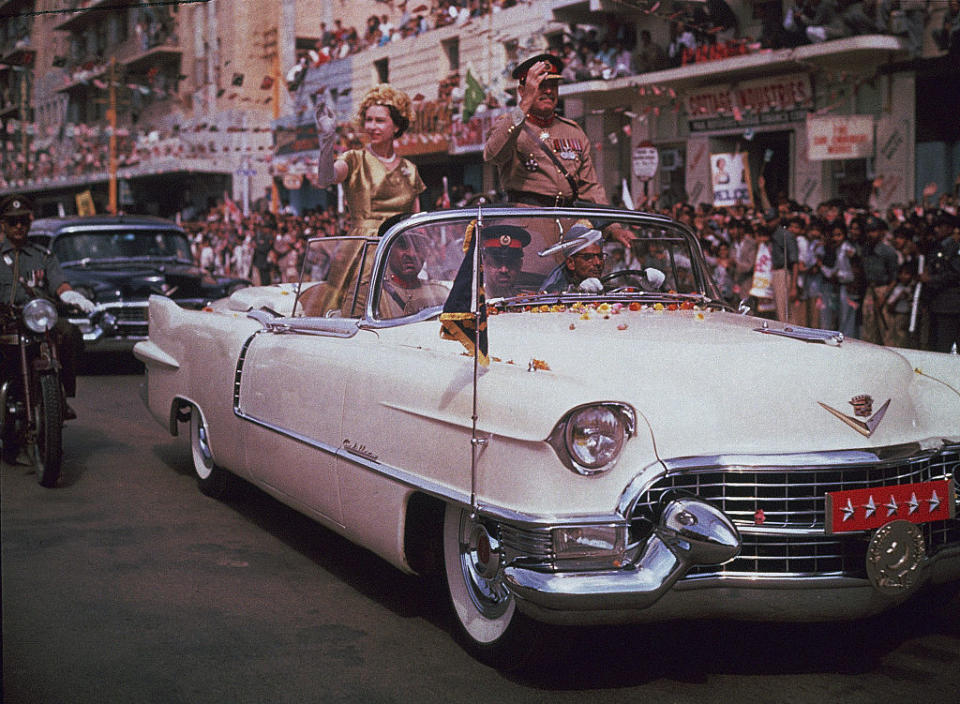 The Queen waves to crowds during a 1961 visit to Pakistan [Photo: Getty]