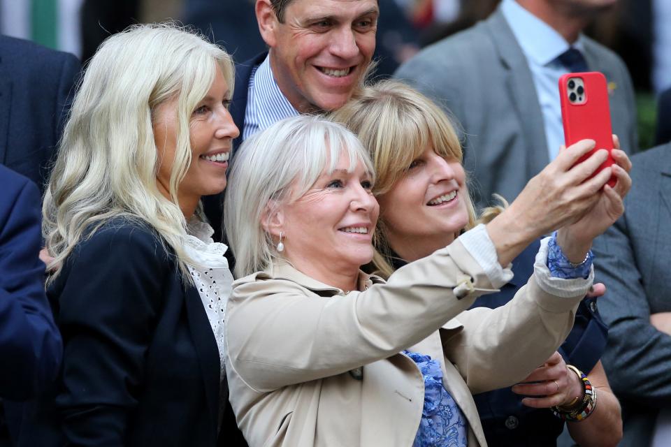 Britain's former Culture Secretary Nadine Dorries (C), and Rachel Johnson (R) take a selfie photograph as they gather to listen to Britain's outgoing Prime Minister Boris Johnson make his leaving speech in Downing Street, central London, on September 6, 2022. - British Prime Minister Boris Johnson formally tenders his resignation to Queen Elizabeth II on Tuesday, handing over power to Liz Truss after his momentous tenure dominated by Brexit and Covid was cut short by scandal. (Photo by ISABEL INFANTES / AFP) (Photo by ISABEL INFANTES/AFP via Getty Images)