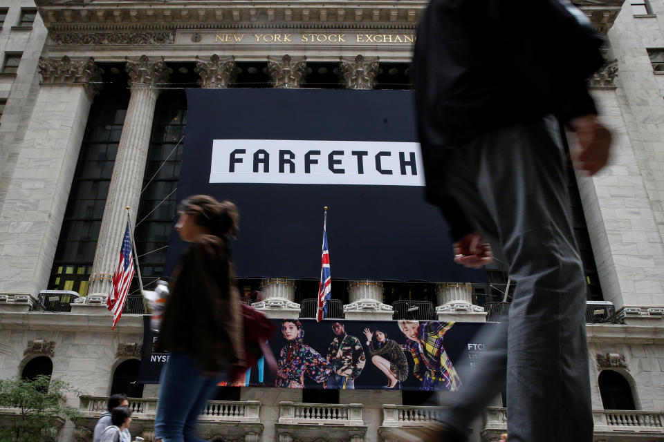 A banner to celebrate the IPO of online fashion house Farfetch is displayed on the facade of the of the New York Stock Exchange (NYSE) in New York, U.S., September 21, 2018. REUTERS/Brendan McDermid