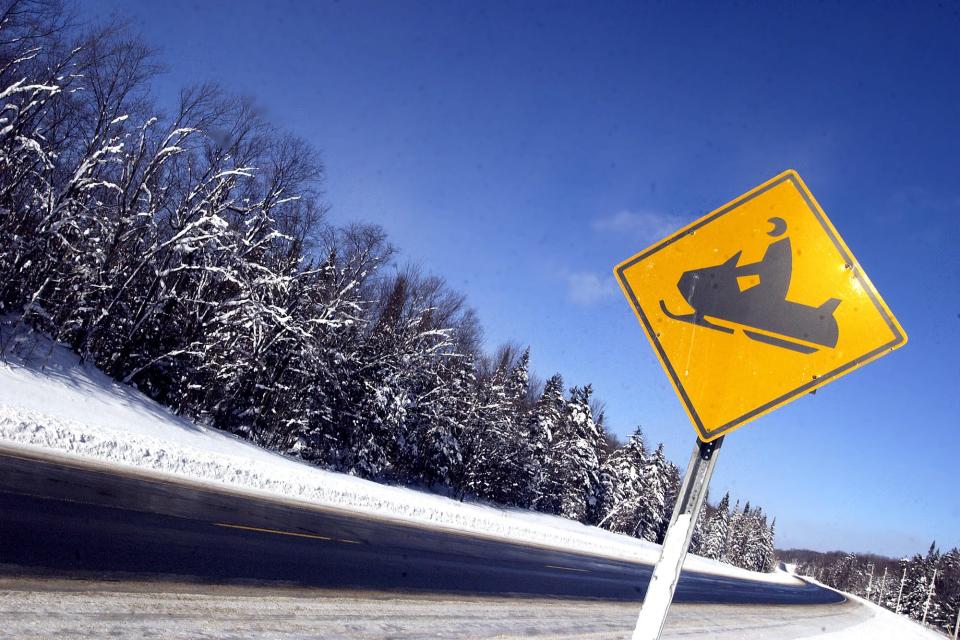 One of the many snowmobile crossing signs that can be seen along Route 28 North to alert drivers to the heavy snowmobile traffic near Old Forge.