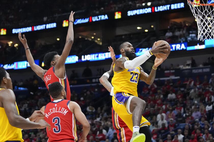 Los Angeles Lakers forward LeBron James (23) goes to the basket in the first half of an NBA basketball play-in tournament game against the New Orleans Pelicans, Tuesday, April 16, 2024, in New Orleans. (AP Photo/Gerald Herbert)