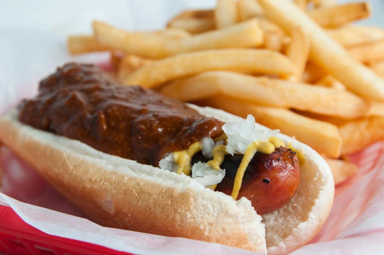 Closeup One Half Smokes with fries blurred in the top right background at Ben's Chili Bowl, Washington D.C.