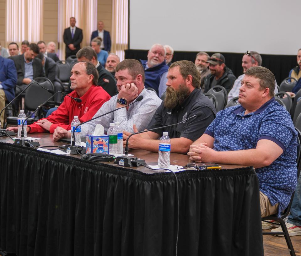 Local firefighters Robert Ford (left) Trent Price, Phillip Clark and Scott Brewster sit before an investigative house committee hearing Tuesday regarding the Texas Panhandle wildfires in Pampa.