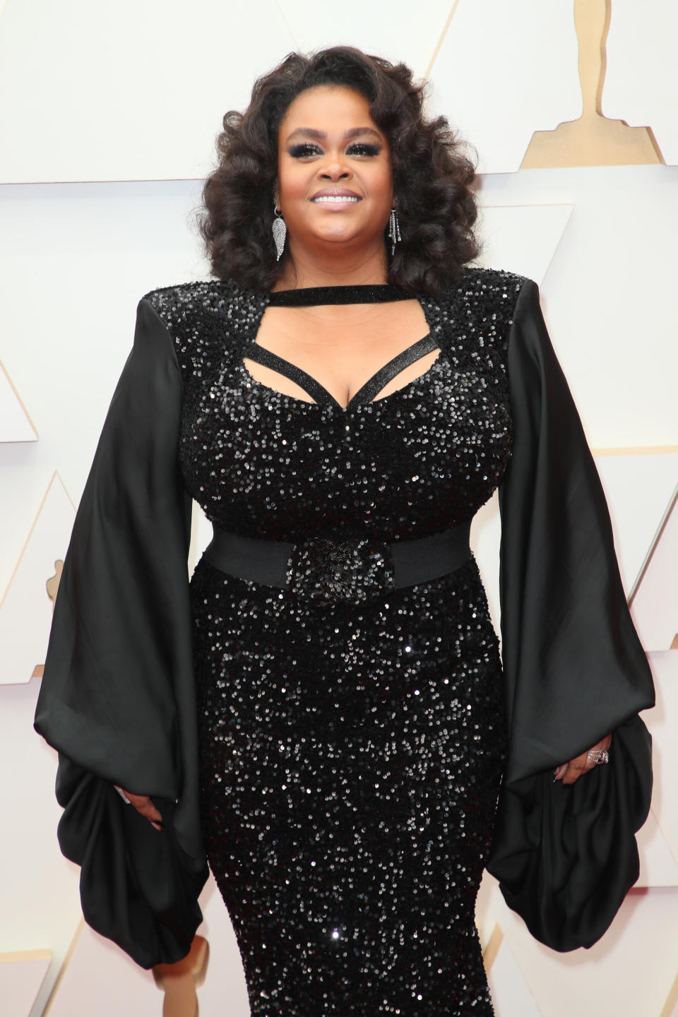 Jill Scott wearing all black sequin dress.