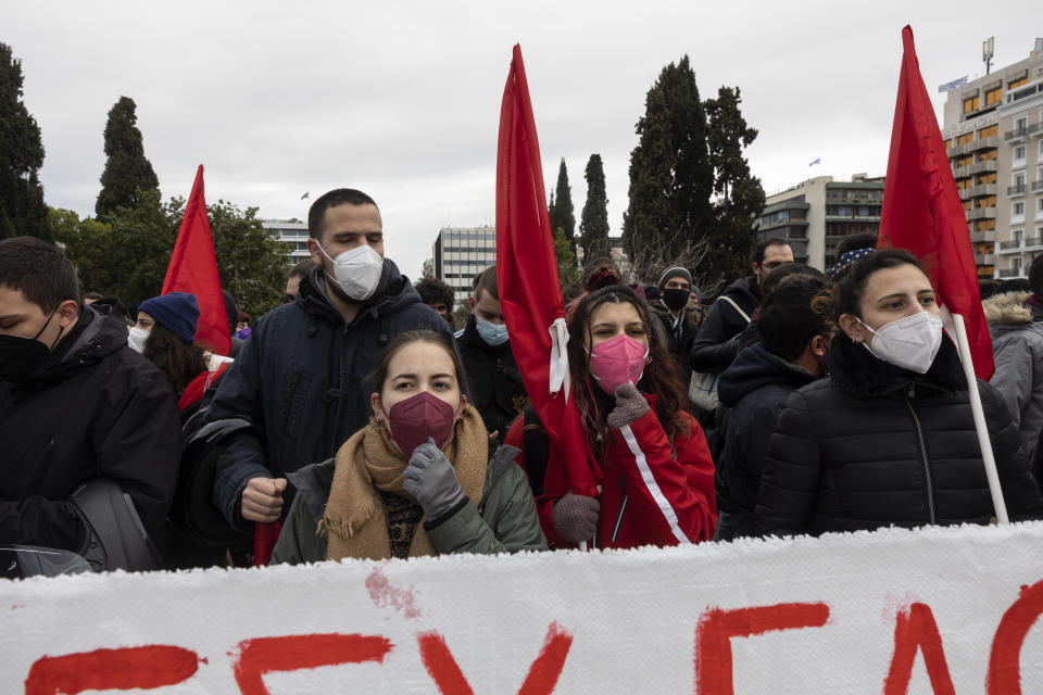 Protesters take part in an anti-government rally at central Syntagma square in Athens, on Saturday, Jan. 22, 2022. Hundreds protesters gathered to protest staff shortages in state heath sector and compulsory coronavirus vaccinations. (AP Photo/Yorgos Karahalis)