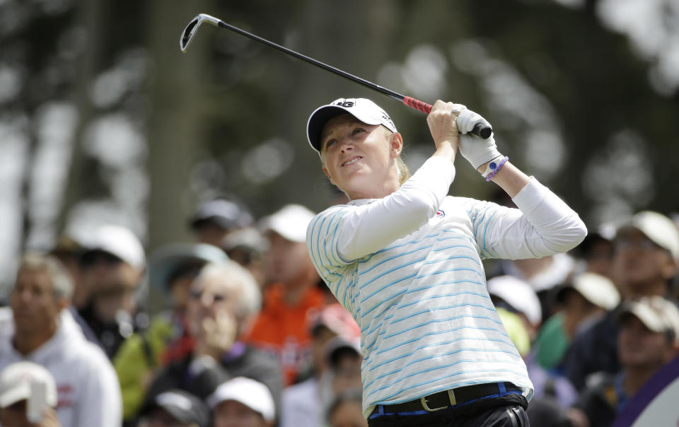 Stacy Lewis follows her shot from the third tee of Lake Merced Golf Club during the final round of the Swinging Skirts LPGA Classic golf tournament on Sunday, April 27, 2014, in Daly City, Calif. (AP Photo/Eric Risberg)