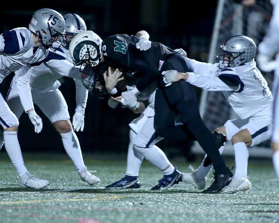 Marshfield's Tor Maas churns his legs to power his way into the end zone to give Marshfield the 28-13 lead over Plymouth North during third quarter action of their game in the Sweet 16 round of the Division 2 state tournament at Marshfield High on Friday, Nov. 3, 2023. Marshfield would go on to win 55-34.
