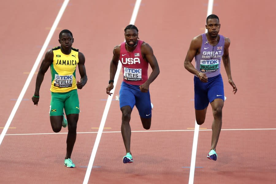 BUDAPEST, HUNGARY – AUGUST 20: Oblique Seville of Team Jamaica, Noah Lyles of Team United States, and Zharnel Hughes of Team Great Britain compete in the Men’s 100m Final during day two of the World Athletics Championships Budapest 2023 at National Athletics Centre on August 20, 2023 in Budapest, Hungary. (Photo by Steph Chambers/Getty Images)