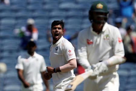 Cricket - India v Australia - First Test cricket match - Maharashtra Cricket Association Stadium, Pune, India - 25/02/17. India's Umesh Yadav celebrates the wicket of Australia's Nathan Lyon. REUTERS/Danish Siddiqui