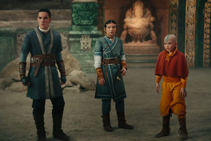 Sokka, Katara, and Aang stand in an arena together in Avatar: The Last Airbender.