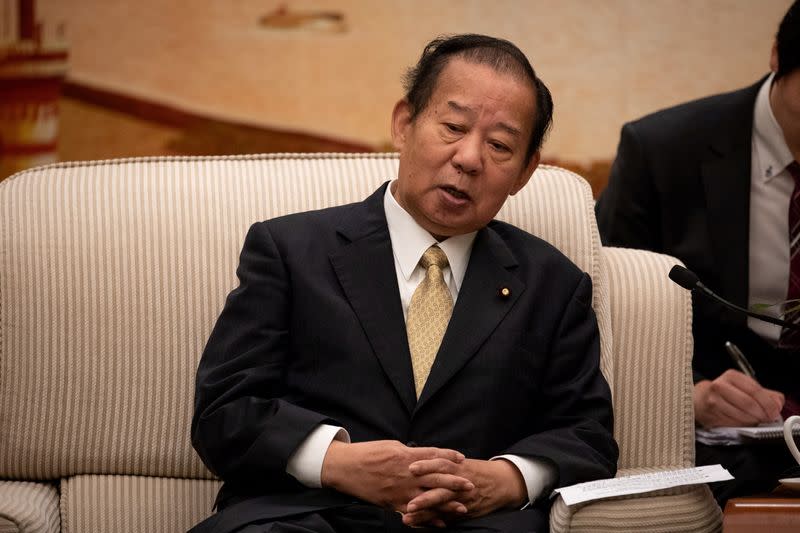 FILE PHOTO : Toshihiro Nikai, Secretary General of the Japanese Liberal Democratic Party, talks to Chinese Foreign Minister Wang Yi during their meeting at the Great Hall of the People in Beijing