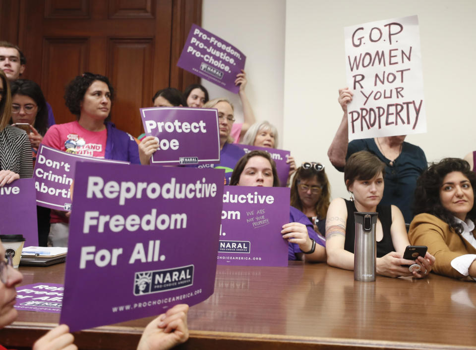 Supporters crowd a meeting room before a roundtable discussion at the Georgia State Capitol in Atlanta on Thursday, May 16, 2019 to discuss abortion bans in Georgia and across the country. Georgia was the fourth state this year to pass anti-abortion "heartbeat" legislation, but Democratic presidential candidates have taken aim at the state's law banning most abortions after six weeks that's set to go into effect in January. (Bob Andres/Atlanta Journal-Constitution via AP)