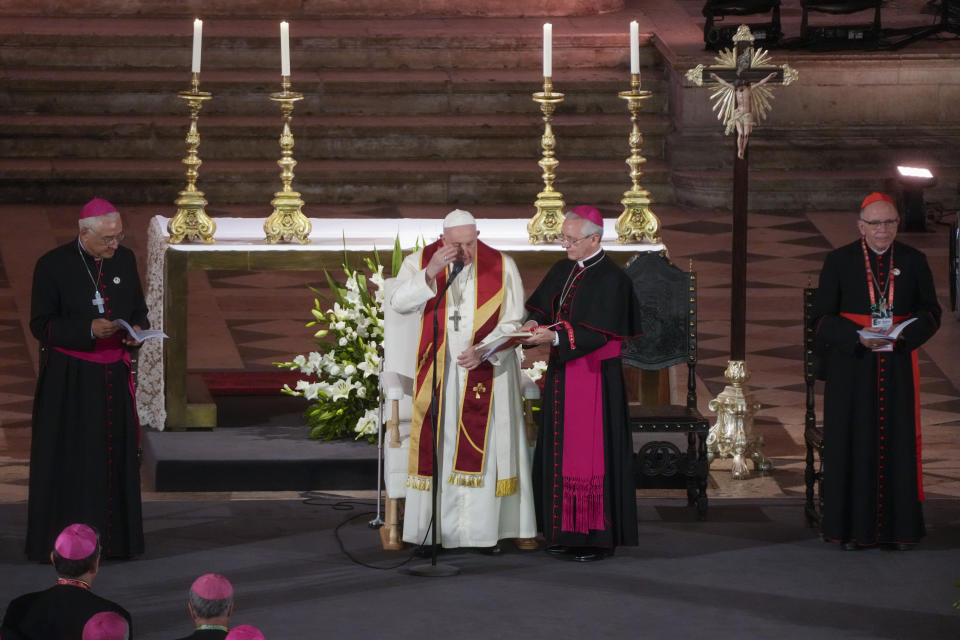 Pope Francis, with Lisbon's Patriarch, Cardinal Manuel Clemente, right, Archbishop Diego Ravelli, second from right, President of the Portuguese Conference of Bishops José Ornelas Carvalho, left, starts the vespers inside the 16th-century Jeronimos Monastery and church in Lisbon, Wednesday, Aug. 2, 2023. Francis, who will open the World Youth Day on Sunday is meeting with Portugal's Catholic hierarchy, who recently began the process of reckoning with their legacy of clergy sexual abuse. (AP Photo/Gregorio Borgia)