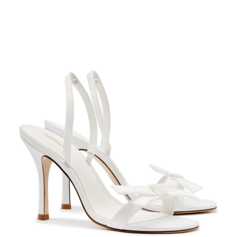 Larroudé x Markarian Bridal Sandal In White Satin, $375, <a href="https://rstyle.me/+aFV8V-izfeI6rWtnsCBm-Q" rel="nofollow noopener" target="_blank" data-ylk="slk:available here;elm:context_link;itc:0;sec:content-canvas" class="link ">available here</a>