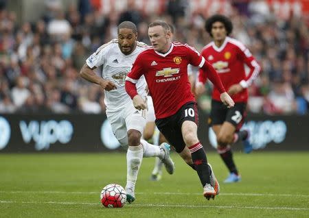 Football - Swansea City v Manchester United - Barclays Premier League - Liberty Stadium - 30/8/15 Manchester United's Wayne Rooney in action with Swansea's Ashley Williams Action Images via Reuters / John Sibley Livepic