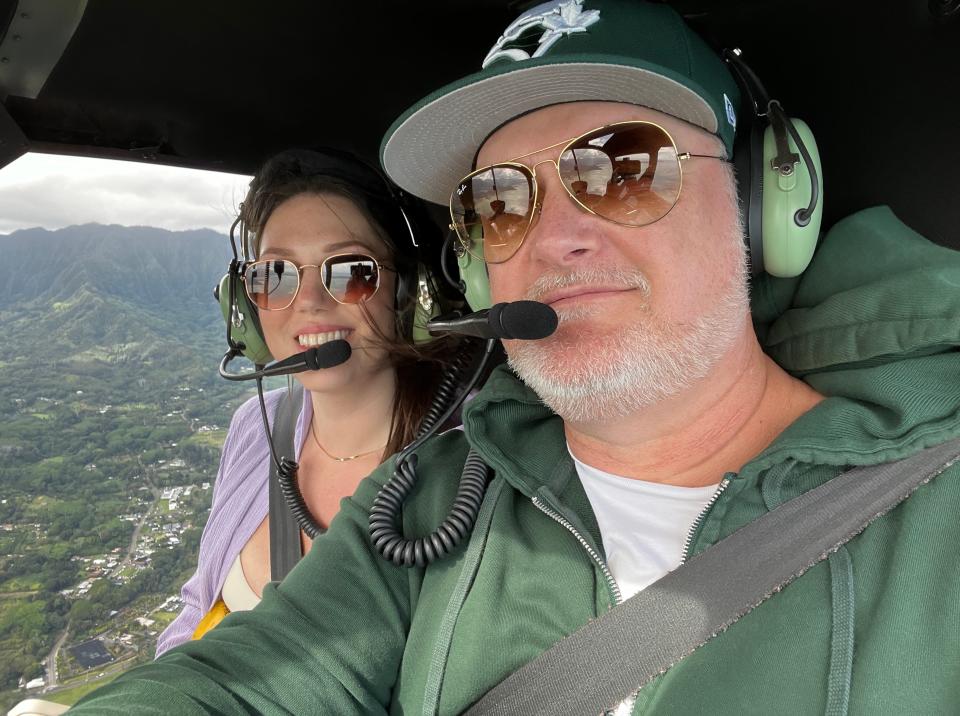 Jess Lewis and her boyfriend in a helicopter