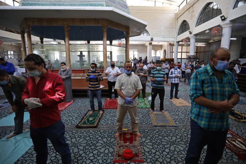 Muslims take part in Friday prayers at al Husseini mosque in Amman