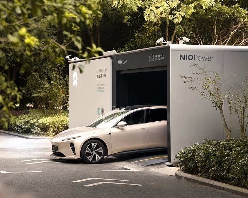 A Nio EV exits one of the company's battery-swap stations. 