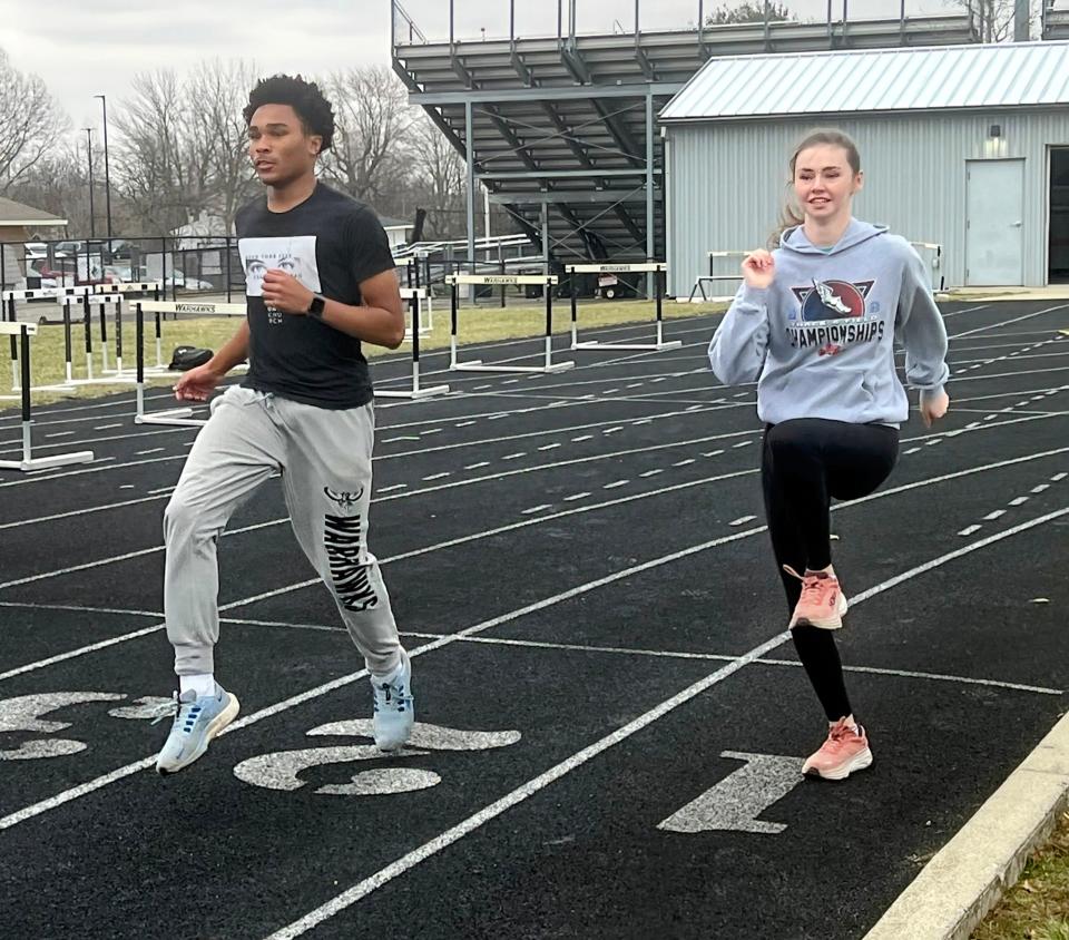 Westerville Central’s Elijah Harris trains at the school with Taryn Stills.