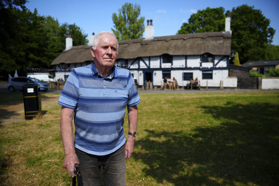 Author Derek Rogerson who wrote "The Battle of Bamber Bridge: The True Story" stands by the Ye Olde Hob Inn in Bamber Bridge near Preston, England, Wednesday, June 7, 2023. What is now known as the Battle of Bamber Bridge erupted there on June 24, 1943 when white military police officers confronted black soldiers enjoying a night off in the local pub. (AP Photo/Jon Super)