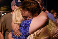 <p>Ann Montgomery (L) and April Higgins, members of First Baptist Church, embrace during a vigil for victims of a mass shooting in Sutherland Springs, Texas, Nov. 5, 2017. (Photo: Mohammad Khursheed/Reuters) </p>