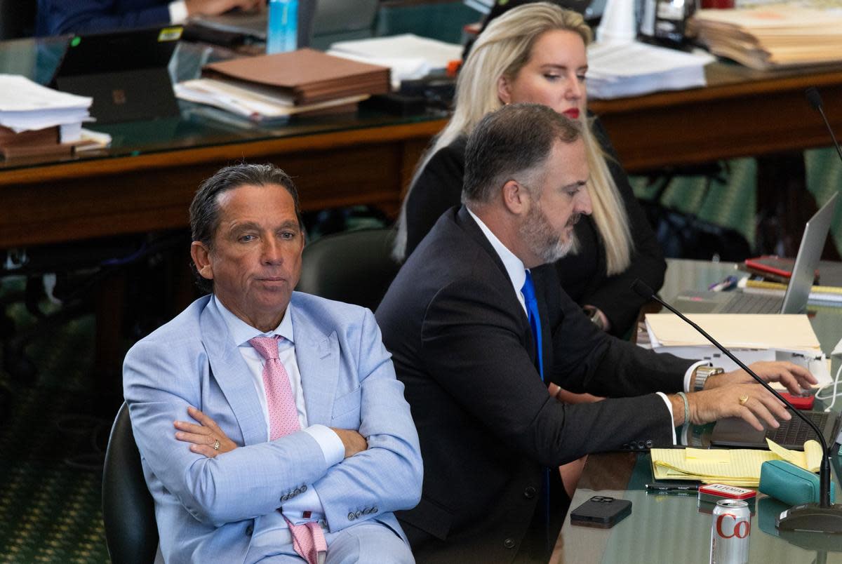 Tony Buzbee, a lead defense attorney, listens in as Grant Dorfman, Deputy First Assistant Attorney General at the Texas Office of  the Attorney General, is questioned by the defense team on the Senate floor during suspended Attorney General Ken Paxton’s trial on Sept. 14, 2023.