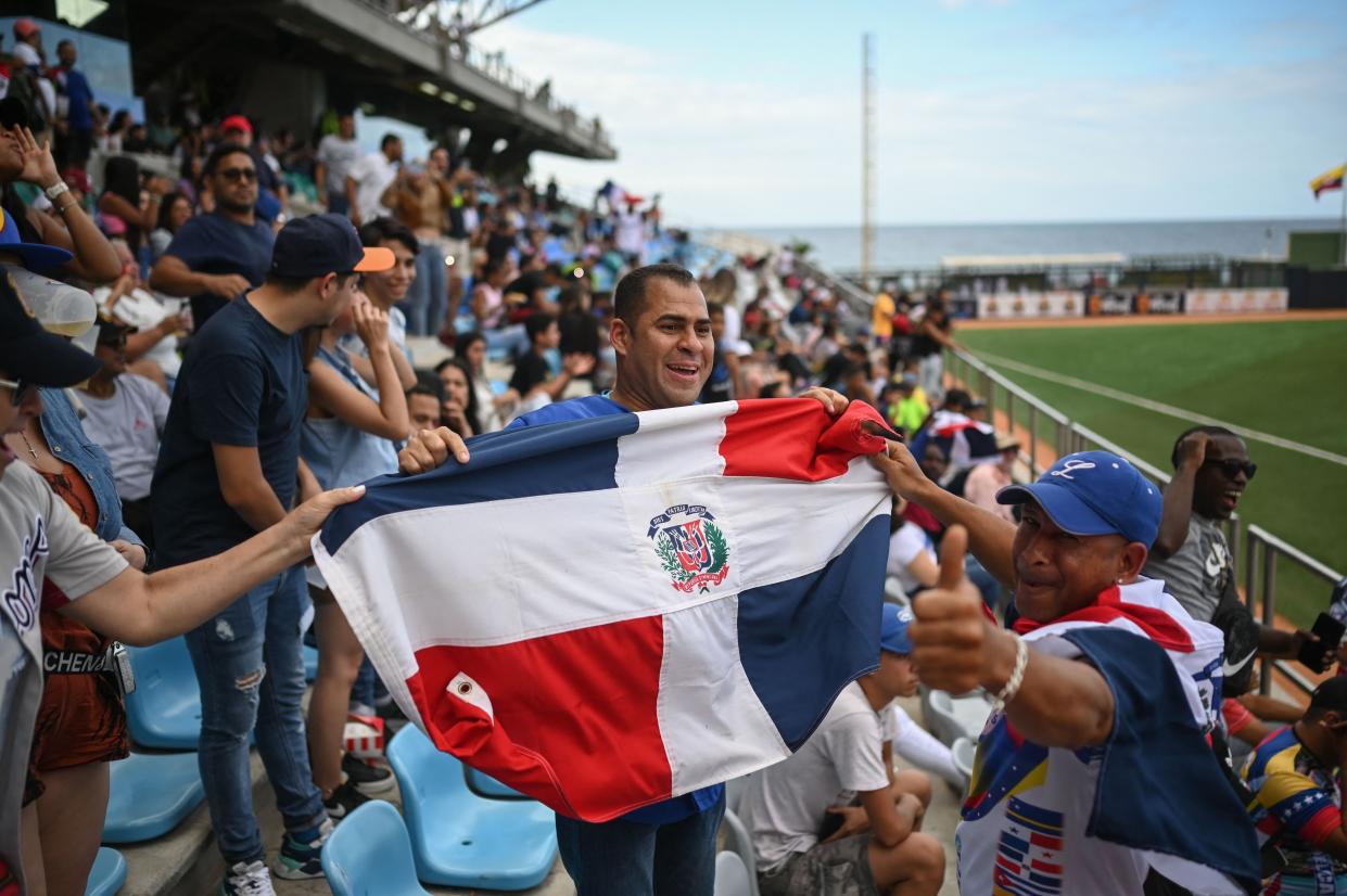 Fans wave a Dominican flag at last year's Caribbean Series. (Federico Parra/AFP via Getty Images)