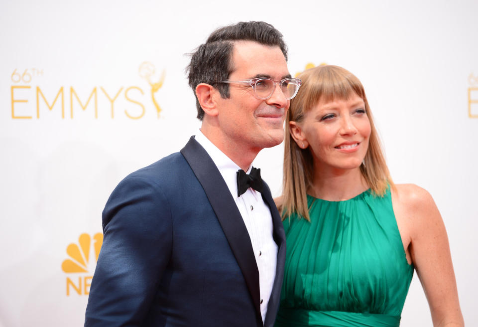 Ty Burrell, left, and Holly Burrell arrive at the 66th Annual Primetime Emmy Awards at the Nokia Theatre L.A. Live on Monday, Aug. 25, 2014, in Los Angeles. (Photo by Jordan Strauss/Invision/AP)