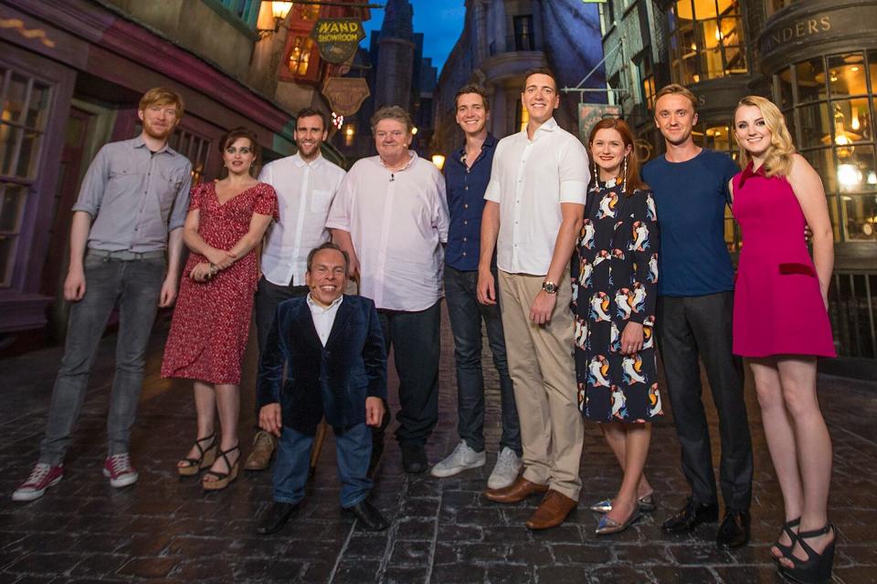 In this handout provided by Universal Orlando Resort, Harry Potter film stars including Helena Bonham Carter (Bellatrix Lestrange), Robbie Coltrane (Hagrid) Tom Felton (Draco Malfoy), Matthew Lewis (Neville Longbottom) attended an exclusive preview of The Wizarding World of Harry Potter - Diagon Alley at Universal Orlando Resort on June 18, 2014 in Orlando, Florida.