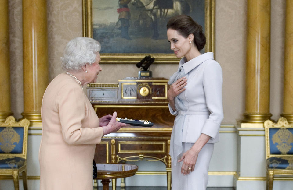 Angelina Jolie honored by Queen Elizabeth in 2014 (Anthony Devlin / Reuters)