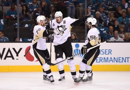 Jun 6, 2016; San Jose, CA, USA; Pittsburgh Penguins center Evgeni Malkin (71) celebrates with right wing Patric Hornqvist (72) and defenseman Kris Letang (58) after scoring a goal against the San Jose Sharks in the second period in game four of the 2016 Stanley Cup Final at SAP Center at San Jose. Mandatory Credit: Kyle Terada-USA TODAY Sports