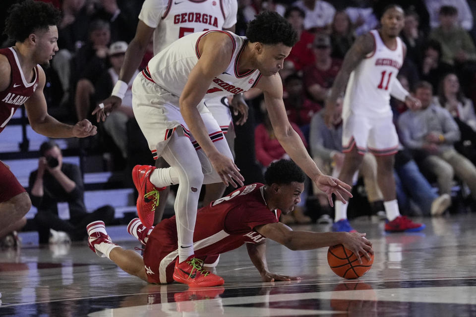 Alabama guard Rylan Griffen (3) recovers the ball afte it was knocked away by Georgia guard Jabri Abdur-Rahim (1) in the second half of an NCAA college basketball game Wednesday, Jan. 31, 2024, in Athens, Ga. (AP Photo/John Bazemore)