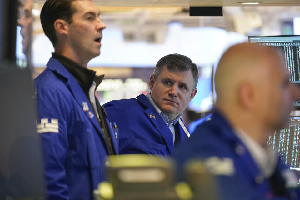 Traders work on the floor at the New York Stock Exchange in New York, Monday, Nov. 28, 2022. (AP Photo/Seth Wenig)