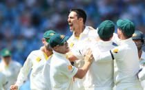 Australia's bowler Mitchell Johnson, center, celebrates with teammates after dismissing South Africa's captain Graeme Smith, for 10 runs on the second day of their their cricket test match at Centurion Park in Pretoria, South Africa, Thursday, Feb. 13, 2014. (AP Photo/ Themba Hadebe)