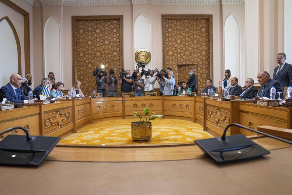 Egyptian Foreign Minister Sameh Shoukry, right, meets with Greek Foreign Minister Nikos Dendias, at the foreign ministry headquarters in Cairo, Egypt, Sunday, Oct. 9, 2022. (AP Photo/Nariman El-Mofty)