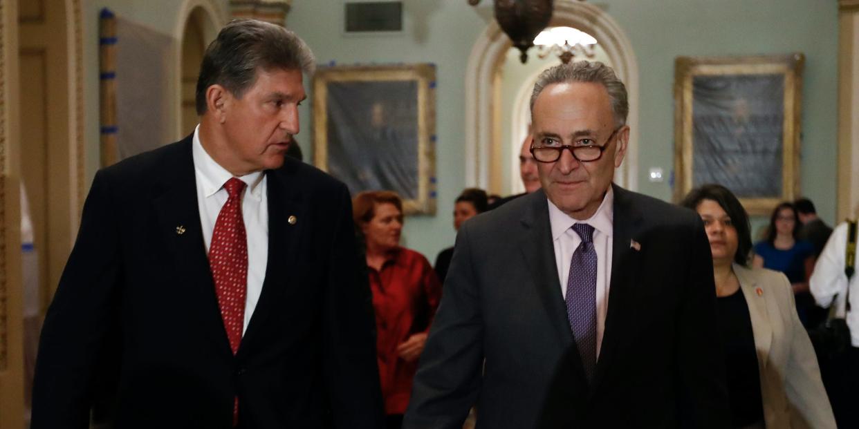 Democratic Sen. Joe Manchin of West Virginia (left) and Senate Majority Leader Chuck Schumer of New York have arrived at a surprise inflation deal that the Senate will start considering on August 6.