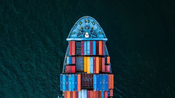 An overhead view of shipping containers on a sea vessel.