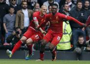Liverpool's Daniel Sturridge (R) celebrates scoring against Manchester United with Martin Skrtel during their English Premier League soccer match at Anfield, Liverpool, northern England September 1, 2013.REUTERS/Phil Noble (BRITAIN - Tags: SPORT SOCCER) FOR EDITORIAL USE ONLY. NOT FOR SALE FOR MARKETING OR ADVERTISING CAMPAIGNS. NO USE WITH UNAUTHORIZED AUDIO, VIDEO, DATA, FIXTURE LISTS, CLUB/LEAGUE LOGOS OR "LIVE" SERVICES. ONLINE IN-MATCH USE LIMITED TO 45 IMAGES, NO VIDEO EMULATION. NO USE IN BETTING, GAMES OR SINGLE CLUB/LEAGUE/PLAYER PUBLICATIONS