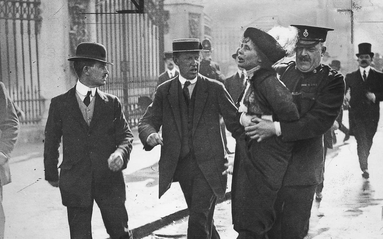 Emily Pankhurst, a prominent member of the suffragettes, being arrested outside Buckingham Palace