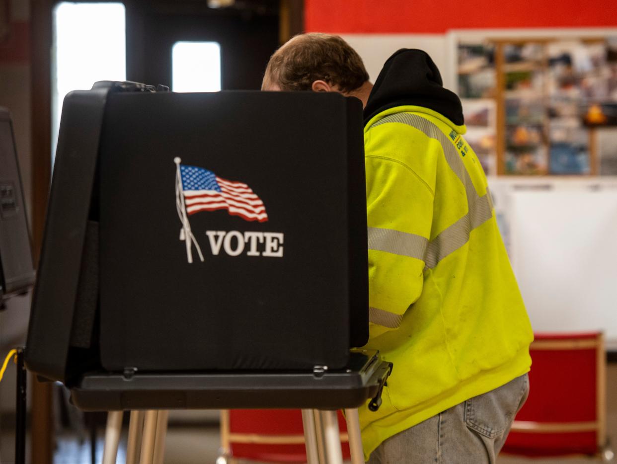 A man fills out his ballot in Marine City's Precinct 1 polling place at the Marine City Fire Hall during a special election in 2019.