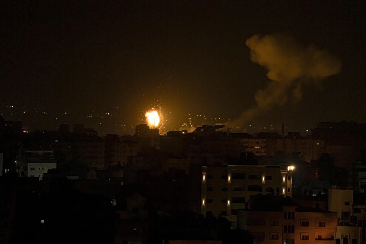 Fire and smoke rises following an Israeli airstrike in central Gaza Strip, Friday, Jan. 27, 2023. Gaza militants fired rockets at Israel and Israel carried out airstrikes as tensions soared following an Israeli raid in the occupied West Bank. The raid killed nine Palestinians, including at least seven militants and a 61-year-old woman. (AP Photo/Fatima Shbair)