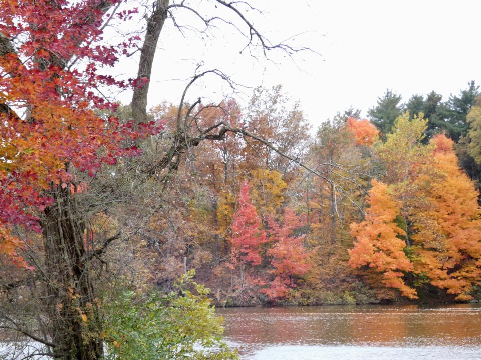 Galion’s Amann Reservoir is surrounded by fall color on Oct. 18.
