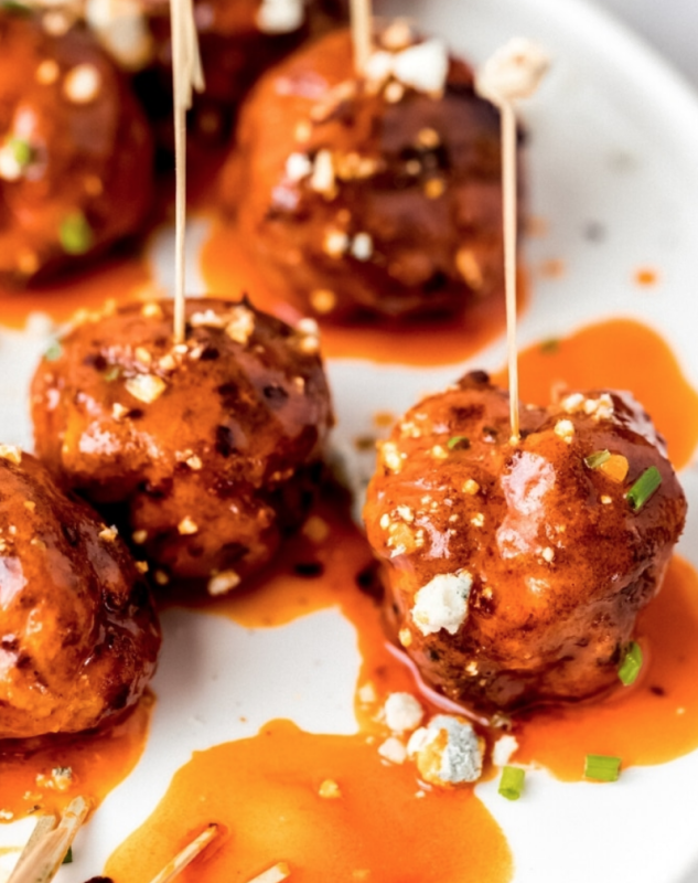 <p>The perfect party appetizer – air fryer buffalo chicken meatballs! They’re healthy-ish, but full of all your favorite buffalo chicken flavors. Made with lean ground chicken and seasonings, a delicious buffalo sauce, and topped with blue cheese crumbles.</p><p><strong>Get the recipe: <a href="https://wanderlustandwellness.org/air-fryer-buffalo-chicken-meatballs/" rel="nofollow noopener" target="_blank" data-ylk="slk:Air Fryer Buffalo Chicken Meatballs;elm:context_link;itc:0;sec:content-canvas" class="link rapid-noclick-resp">Air Fryer Buffalo Chicken Meatballs</a></strong></p>