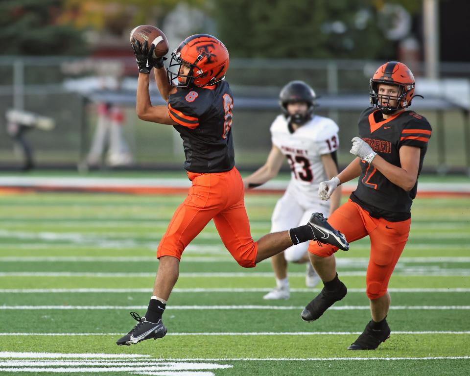 Tecumseh's Diego Juarez hauls in a pass during Friday's game against Pinckney.