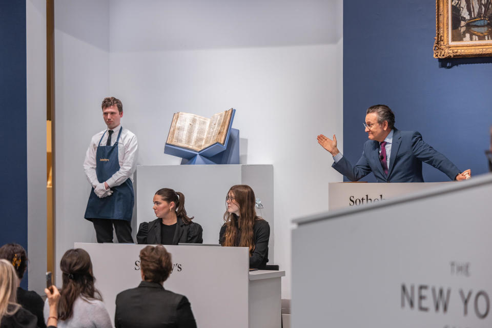Auctioneer takes bids for the Codex Sassoon during the auction at Sotheby's.  / Credit: Sotheby's
