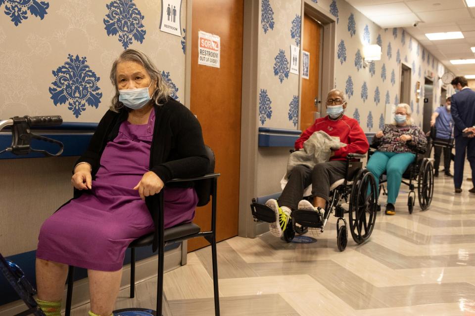In this Friday, Jan. 15, 2021, file photo, nursing home residents wait on line to receive a COVID-19 vaccine at Harlem Center for Nursing and Rehabilitation, a nursing home facility in the Harlem neighborhood of New York.